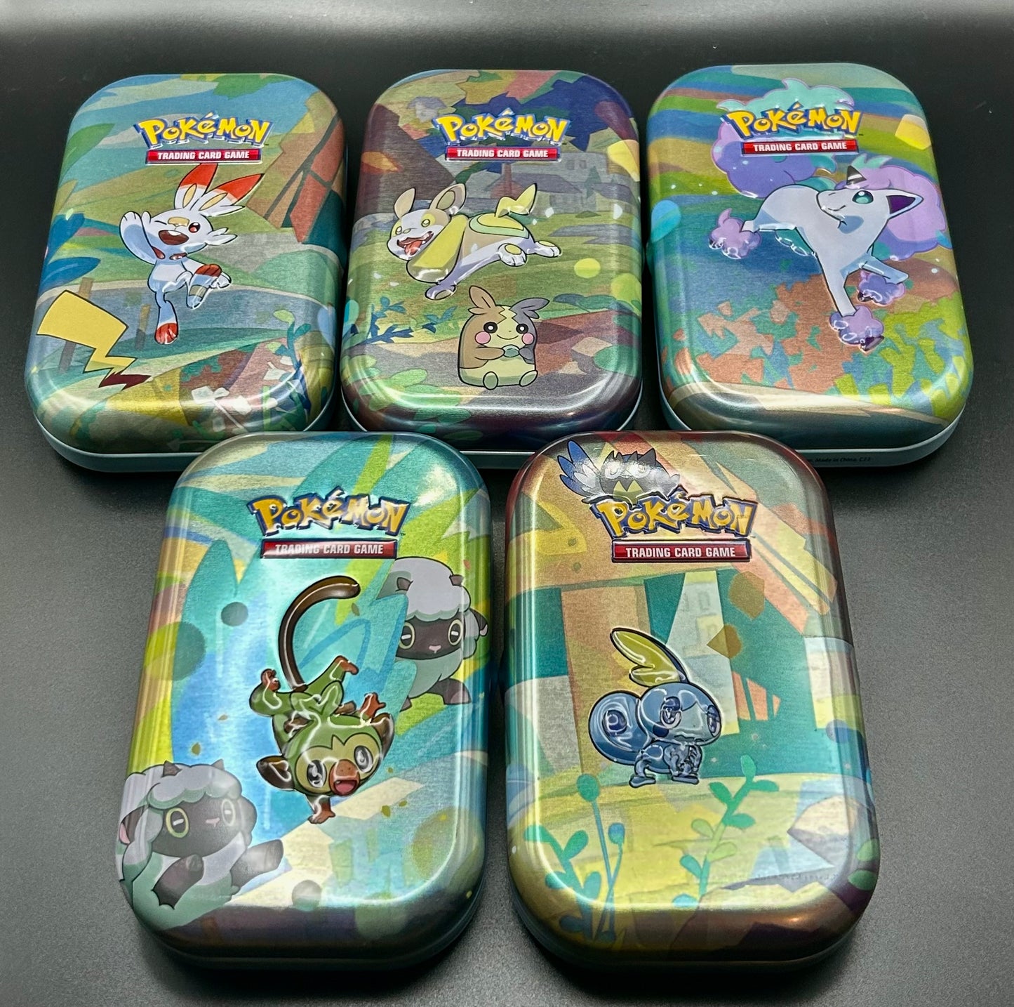 5 Mini Tins including 4 special holo cards