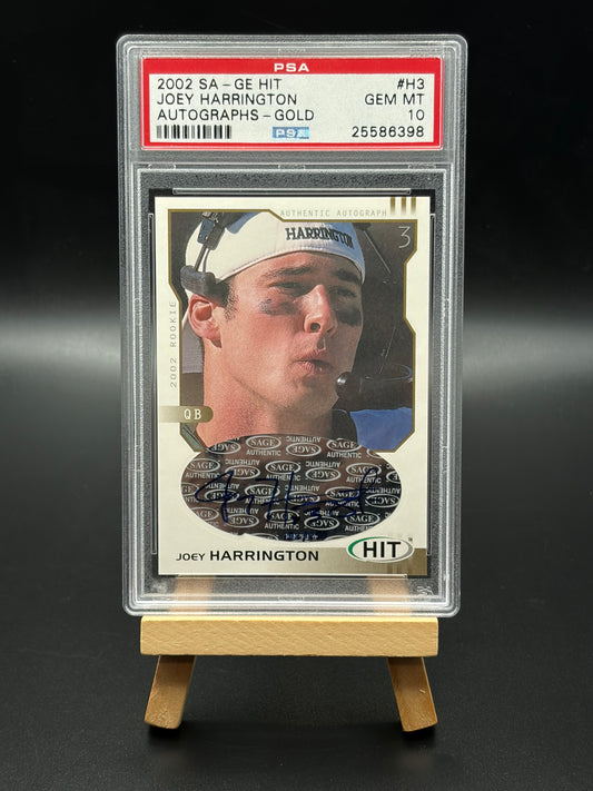 Trading card of Joey Harrington in a protective case on a dark background